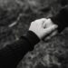 black and white photo of holding hands